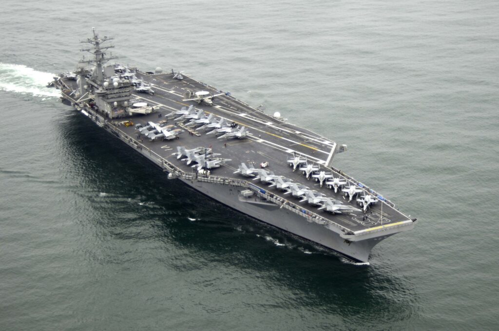 USS Nimitz aircraft carrier with jets on deck USN