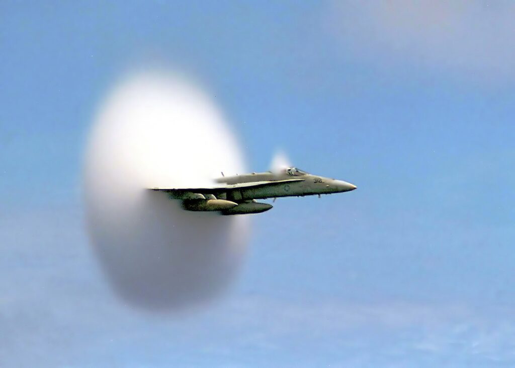 F/A-18 Hornet with vapor cone breaking the sound barrier, US Navy 1999